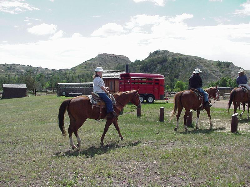 Stephanie and Cathy on horseback.JPG - 2000 - Theodore Roosevelt NP, ND - Stephanie horseback riding in the park
